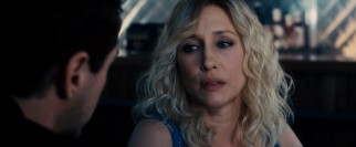 Vera Farmiga unconvincingly plays a bleached blonde bartender, Hank's high school sweetheart turned townie.