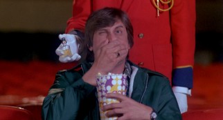 A moviegoer (Jeff Maxwell) has perfume sprayed into his face as part of a "Feel-Around" presentation of "See You Next Wednesday."