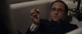 William S. Burroughs (Ben Foster) experiments with drugs in the bathtub.