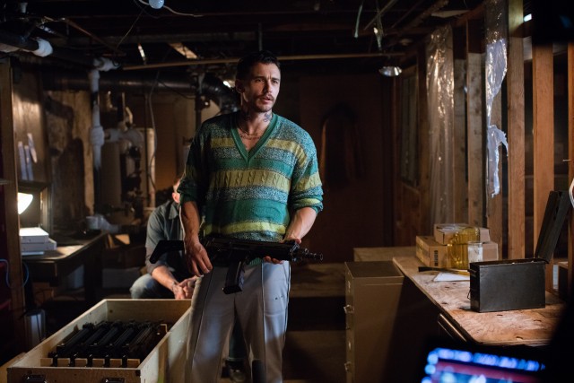 As the villain Taylor Balik, James Franco sports a bad hairdo, ill-fitting sweaters, and neck tatoos.
