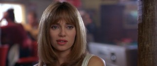 Claudia (Vanessa Angel) becomes the third member of their party, using her looks to help their bowling alley hustle.