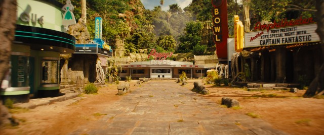 The '50s-flavored Cambodian jungle paradise of drug lord Poppy includes an amphitheatre, a bowling alley, a donut shop, and a burger joint.