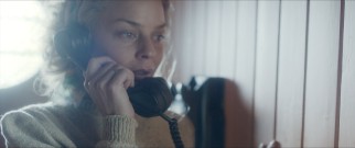 Liv (Agnes Kittelsen) gets a call from her husband as he begins to start his improbable mission from Peru to Polynesia.