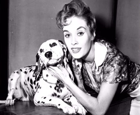 Voice actress Lisa Davis poses with a dalmatian in this still from the 101 Dalmatians: Platinum Edition DVD's production photos gallery.