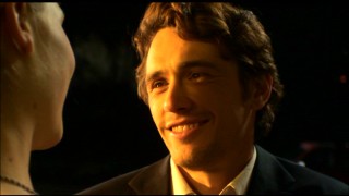 A nicely-dressed Aron Ralston (James Franco) catches up with the girl on his mind in this scene from the long alternate/extended ending.