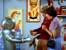 Roger the Robot offers Shirley a friendly handshake before he later attempts to kill Laverne.