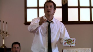 Reverend Cotton Marcus (Patrick Fabian) incorporates a card trick into a spirited sermon at his church.
