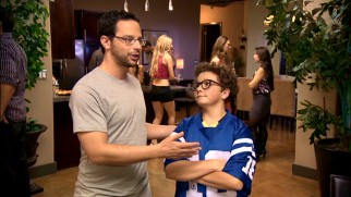 Ruxin (Nick Kroll) consults with legendary young "oracle" Matt Friedman (Paulie Litt) on Draft Night.