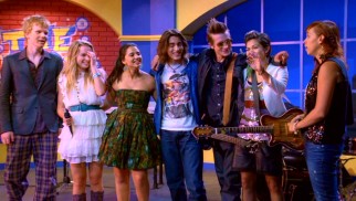 In this Extended Edition DVD's exclusive ending, the newly-expanded Lemonade Mouth appears on talk show The Music Scene with host Moxie Morris (Lauren Poole, far right).