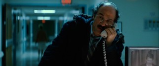 As the mustachioed policeman (Elias Koteas) talks on the phone, Ronald Reagan talks on TV, giving a speech as America's president back in 1983.