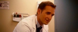 Josh Lucas plays pediatrician Sam "Dr. Love" Nelson, Holly's dapper alternative love interest.