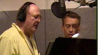 Chris Sanders stands next to and directs David Ogden Stiers. The voice of Jumba (among many other Disney characters) is one of several Lilo & Stitch" cast members featured in Disc 2's documentary.