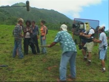 Setting up a scene on the rolling green hills of Oahu.