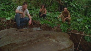 Jack examines the hatch that Locke and Boone have worked for weeks to dig up secretly.