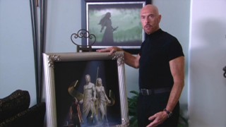 Author Terry Goodkind shows off his favorite piece of cover art for his series, done by Keith  Parkinson.
