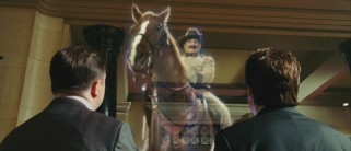 Dr. McPhee and Larry take a look at the high-tech new interactive exhibit featuring a holographic Theodore Roosevelt (Robin Williams).