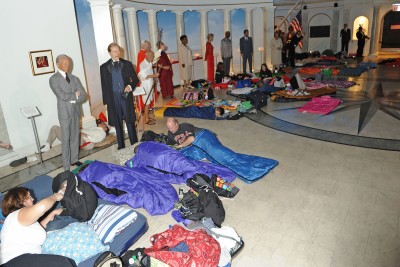 As wax renderings of world leaders stand watching, children and adults get tucked into sleeping bags for a night at the museum.