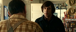 While on Moss' trail, Anton Chigurh (Javier Bardem) meets local folk like the gasoline clerk who quickly becomes his friend-o.