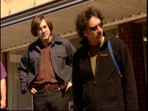 Javier Bardem listens to Joel Coen's directions outside of the Mike Zoss Pharmacy in "The Making of 'No Country for Old Men'."