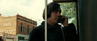 Anton Chigurh (Javier Bardem) phones a friend-o.