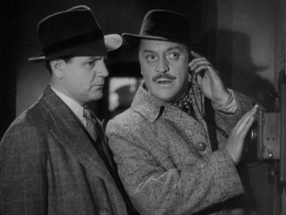 Deadpan comic relief destined for their own radio series and film, Charters (Basil Radford, right) and Caldicott (Naunton Wayne) luck out in overhearing a critical enemy phone call. Good show, old boys.