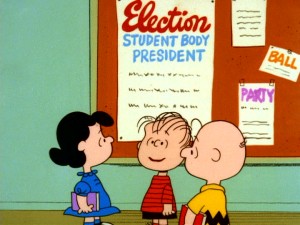 Put up a colorful sign in the hallway and kids will notice. Linus hatches an election campaign for student body president with Lucy and Charlie Brown showing support.