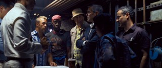 Danny again calls the shots in this latest gathering of the Ocean's gang. Among those seen here are, left to right, Scott Caan, Don Cheadle, Carl Reiner, and Eddie Jemison, each playing a skilled part in the plan.