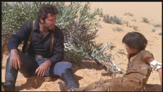 After shooting the boy, Clint gets formally introduced in the desert