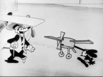 Pegleg Pete scoffs at Oswald's tiny plane like only a bad guy would in "The Ocean Hop."