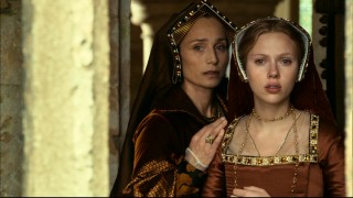 Mama Boleyn (Kristin Scott Thomas) offers words of comfort to Mary as they watch a staged scene in the courtyard.