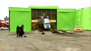 The heroic cops' car crashing through a building facade vertically is a cool effect seen in "Crash and Burn!" but ultimately not the take used in the film.