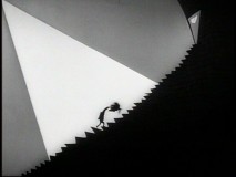 A depressed Vincent Malloy ascends a ginormous staircase in the Vincent Price-narrated "Vincent."
