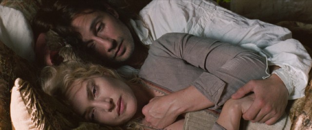 Andr Le Notre (Mattias Schoenaerts) comforts Sabine de Barra (Kate Winslet) as the trauma teased throughout the film is finally revealed.