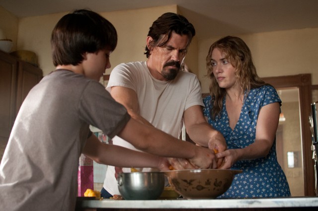 In "Labor Day", Henry (Gattlin Griffith) and Adele (Kate Winslet) help Frank (Josh Brolin) make a peach pie in the way Joyce Maynard's mother did.