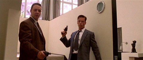 A dirty cop (Russell Crowe) and a spotless clean one (Guy Pearce) reluctantly team up to uncover a police conspiracy in "L.A. Confidential."