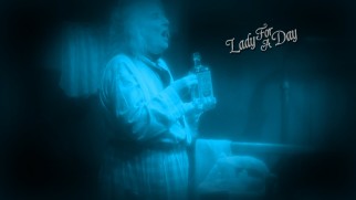Apple Annie gets happy with a bottle of booze on the Lady for a Day Blu-ray menu.