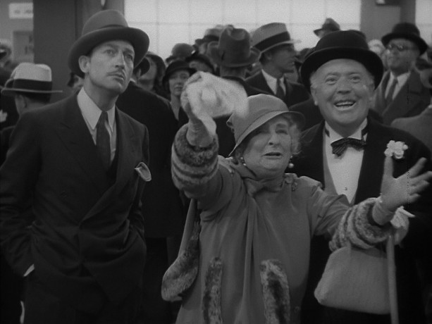 Dave the Dude (Warren William), Apple Annie (May Robson), and Judge Blake (Guy Kibbee) are at the dock and looking spiffy to greet Annie's illegitimate daughter and her company.