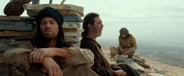 Jesus' (Ewan McGregor) desert solitude is broken by a boy who loves riddles (Tye Sheridan) and a father who doesn't (Ciarn Hinds).