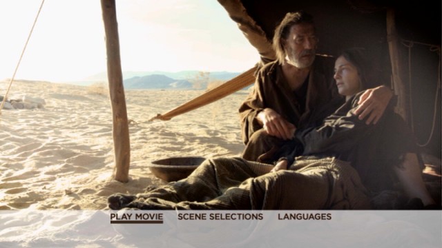 The Father (Ciaran Hinds) comfort his sick wife (Ayelet Zurer) on the basic menu of the Last Days in the Desert DVD.