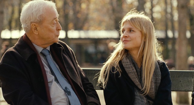An old retired American (Michael Caine) and a young dance teacher (Clmence Posy) share a hot dog lunch in a Paris park in "Last Love."