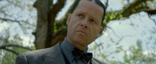 Guy Pearce is almost unrecognizable in the grotesque villain's role of Special Deputy Charley Rakes.
