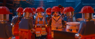 Emmet and Lucy try to blend in among robotic factory workers.