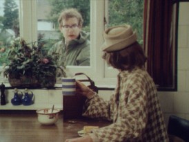 A window cleaner (a young Richard Griffiths) eyes a sausage roll in the Mike Leigh short "A Light Snack."