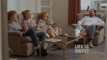 This shot of the family from near the end of the film becomes the simple, static image of Life Is Sweet's Criterion Collection Blu-ray menu.