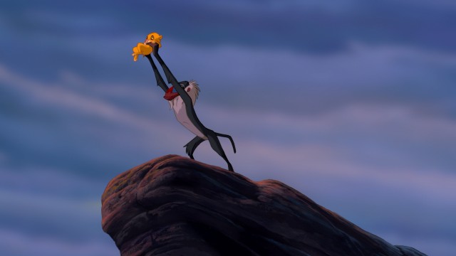 Rafiki presents the newborn Simba in the powerful and iconic "Circle of Life" opening to the film.