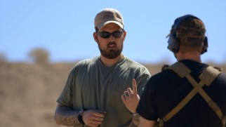 The real Marcus Luttrell advises Ben Foster on how to hold his weapon in "Will of the Warrior."