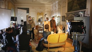 Whit Stillman prepares the actors for a shot in "Behind the Scenes: Love & Friendship."