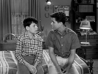 Wally Cleaver (Tony Dow) opens up to his younger brother Beaver (Jerry Mathers) on a matter of the heart in a featured Season 4 "Leave It to Beaver" episode.