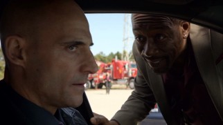 Frank (Mark Strong) and Joe (Lennie James) exchange words near the water where McCann's body is found.