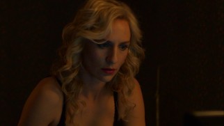 Katia (Mickey Sumner) is surprised to be chatting with the Detroit cop who's stuck on her.